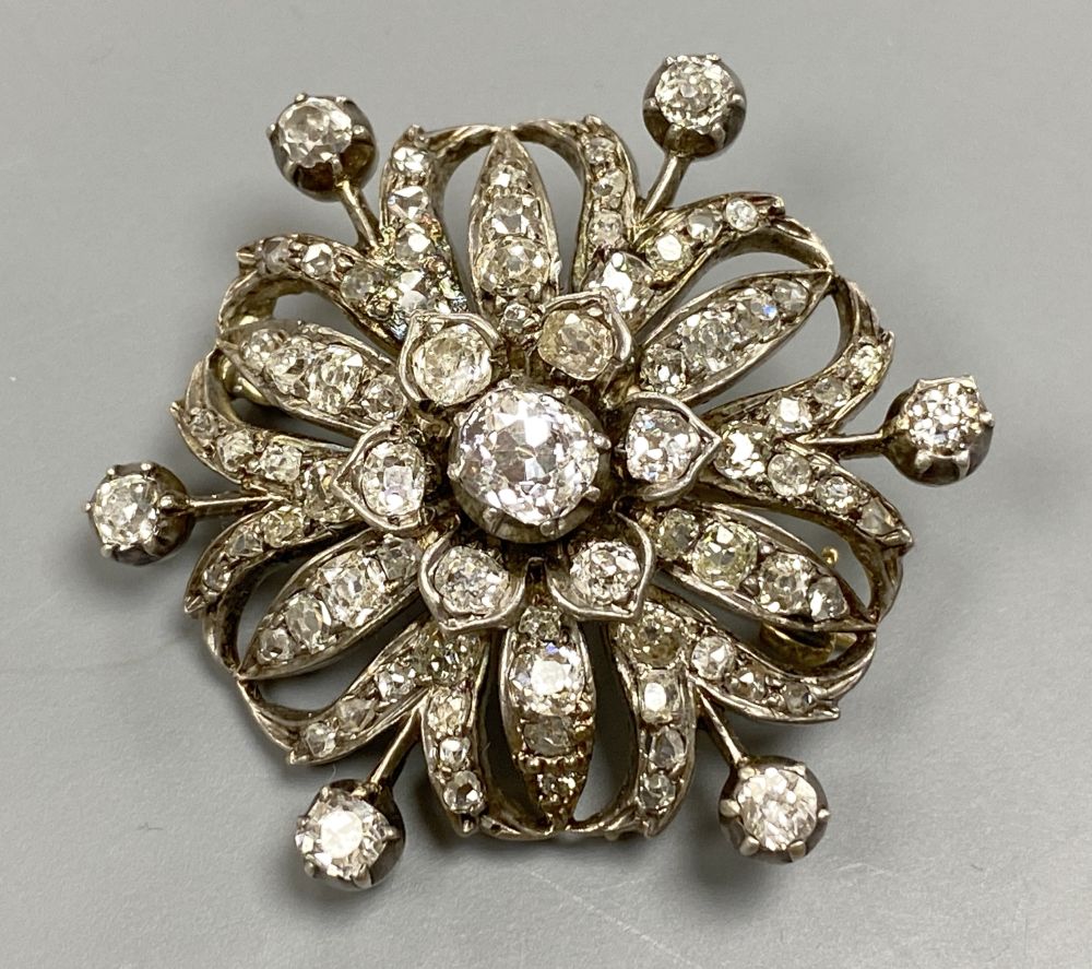 A Victorian pierced yellow and white metal, graduated diamond set circular brooch, 36mm, gross 12.7 grams,